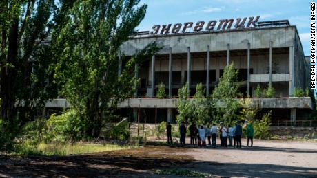 Tourists are guided around the abandoned city of Pripyat, within the Chernobyl Exclusion Zone, in 2019. 