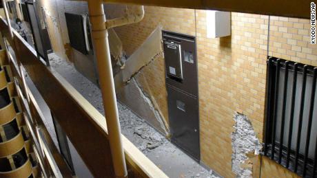 Walls cracked in an apartment building in Fukushima after Wednesday's earthquake.