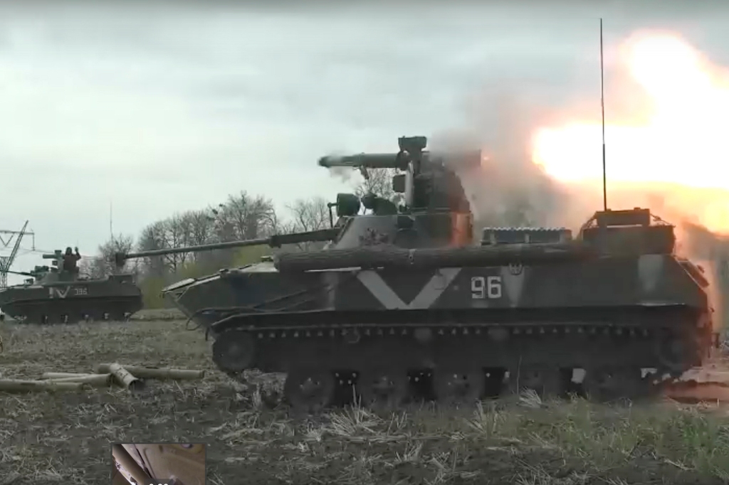 Russian paratroopers on a BMD-4 infantry fighting vehicle firing from an anti-tank missile 