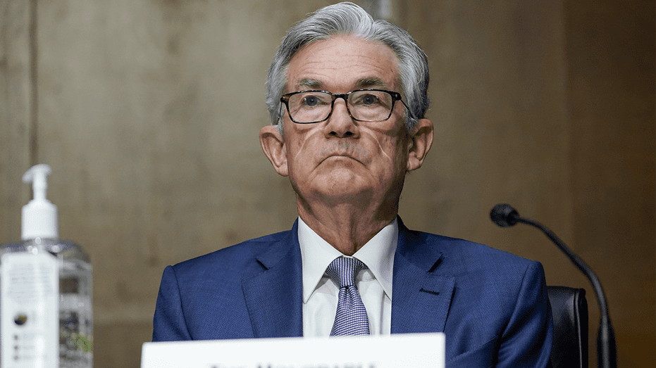 Federal Reserve Chairman Jerome Powell frowns at his testimony