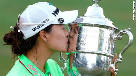 Minji Lee accepted the Harton S Cup.  Semple after winning the last round of the US Open Women's Golf Championship.