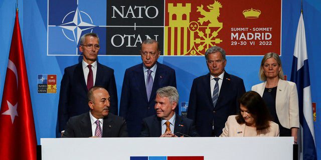 Turkish, Swedish and Finnish officials gather during the NATO summit in Madrid, Spain, June 28, 2022. 