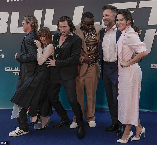 All-Stars: Brad joked with fellow cast members Joey King, Aaron Taylor-Johnson, Brian Tyree Henry, director David Leitch and Kelly McCormick on the blue carpet