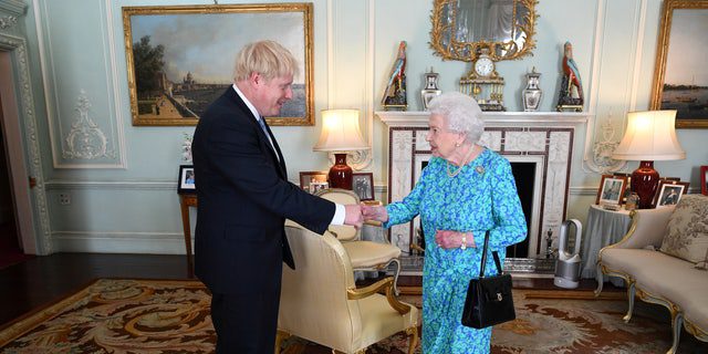 Queen Elizabeth II welcomes Boris Johnson during a meeting at Buckingham Palace, where she will formally introduce him as the new Prime Minister in London on July 24, 2019. 