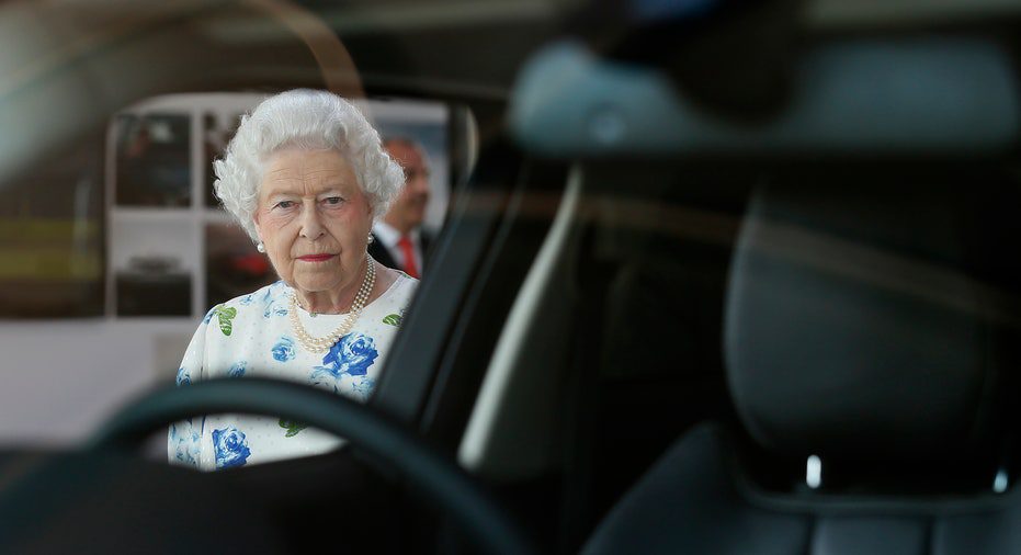 Queen Elizabeth looking out the window of a Range Rover