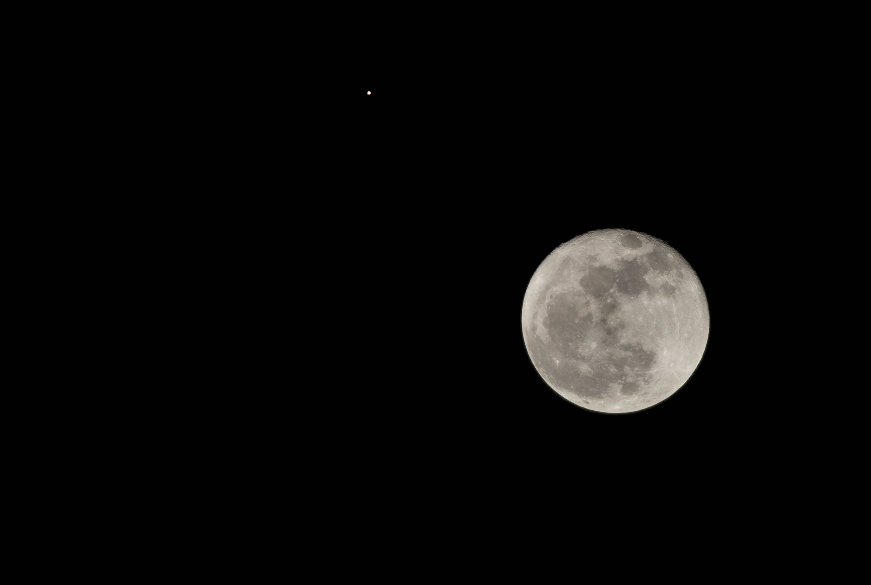 A view of the moon next to the planet Mars, as seen from the city of Bogotá on October 02, 2020.