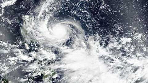 A satellite image from Saturday released by NASA shows Typhoon Noru approaching the Philippines.