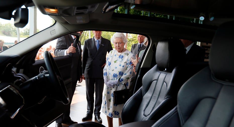 Queen Elizabeth looks at a Range Rover