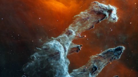 The new James Webb Space Telescope image shows the Pillars of Creation in mid-infrared light.