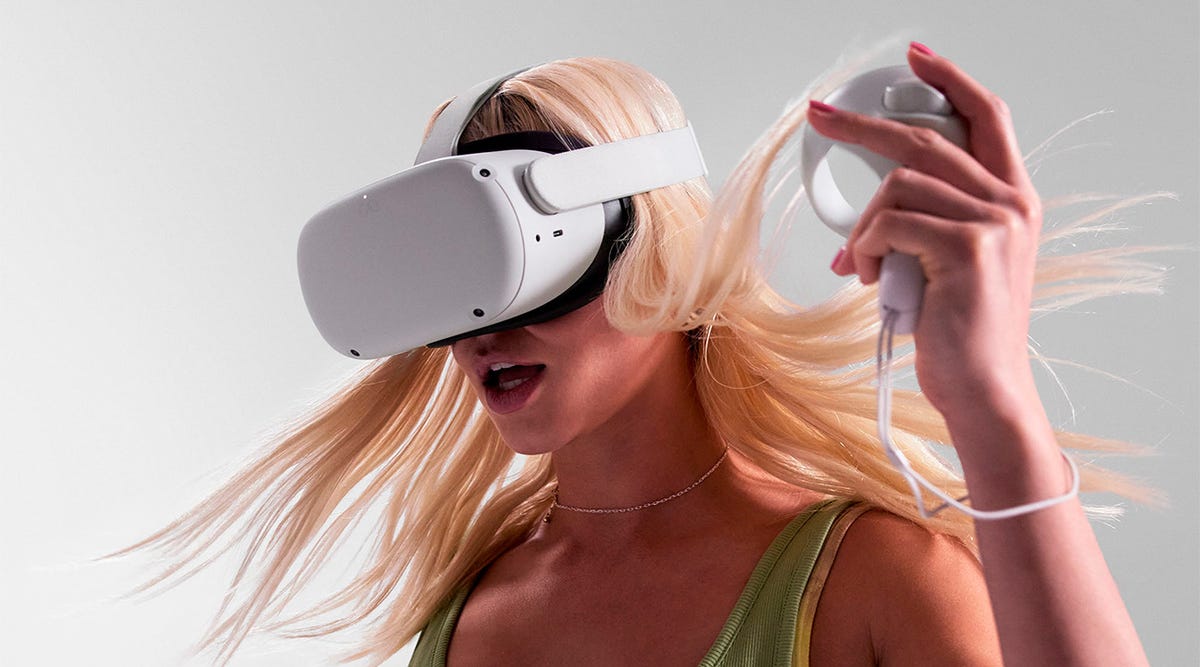 Close-up of a blonde young woman wearing a Meta Quest 2 VR headset