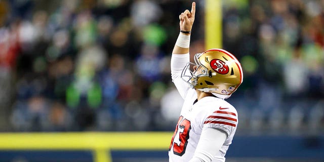 Brock Purdy #13 of the San Francisco 49ers celebrates after a touchdown against the Seattle Seahawks during the third quarter of a game at Lumen Field on December 15, 2022 in Seattle, Washington. 