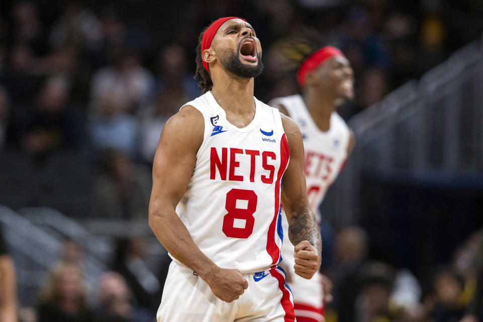 Brooklyn Nets guard Patty Mills (8) reacts during the second half of an NBA basketball game against the Indiana Pacers in Indianapolis, Saturday, Dec. 10, 2022. (AP Photo/Doug McSchooler)